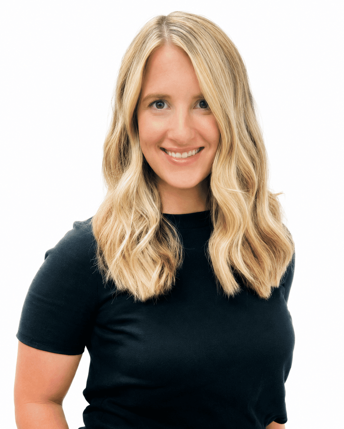 Woman smiling with long blonde hair in a black shirt against a white background.