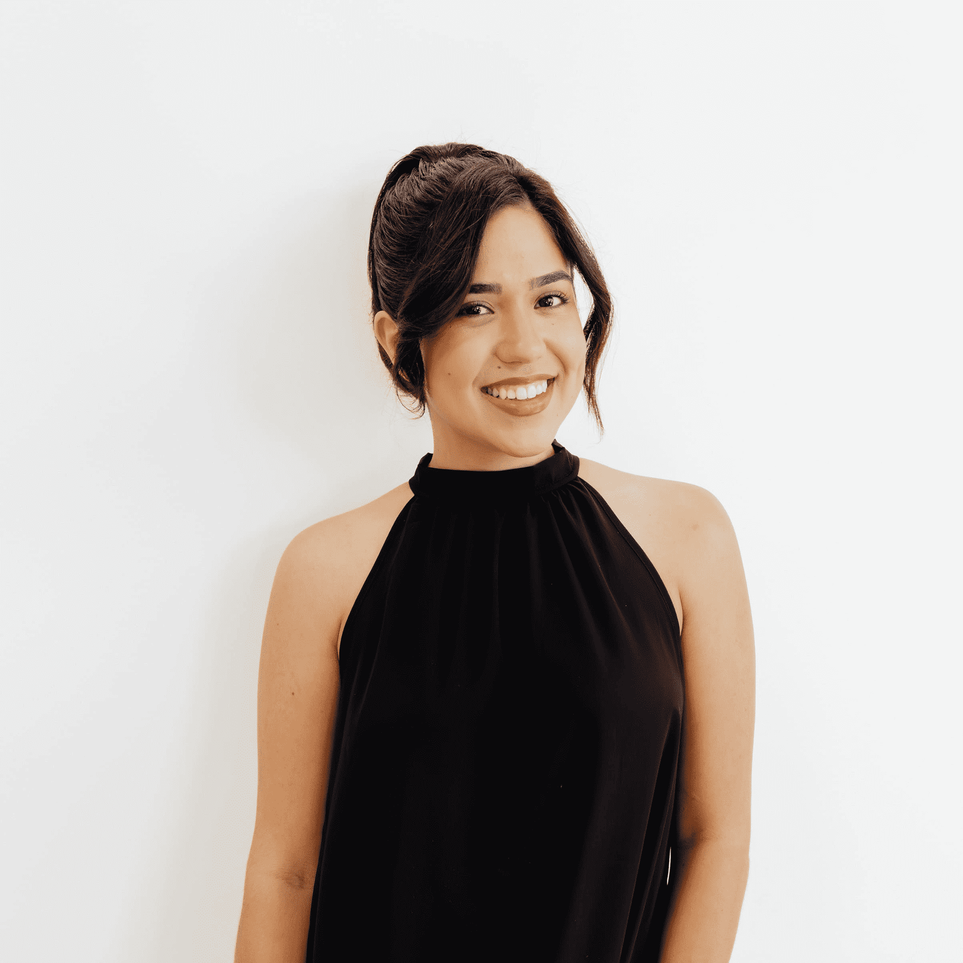 Portrait of Arie Delgado, a professional stylist at Flying Scissors Salon & Spa, showcasing their expertise and style.