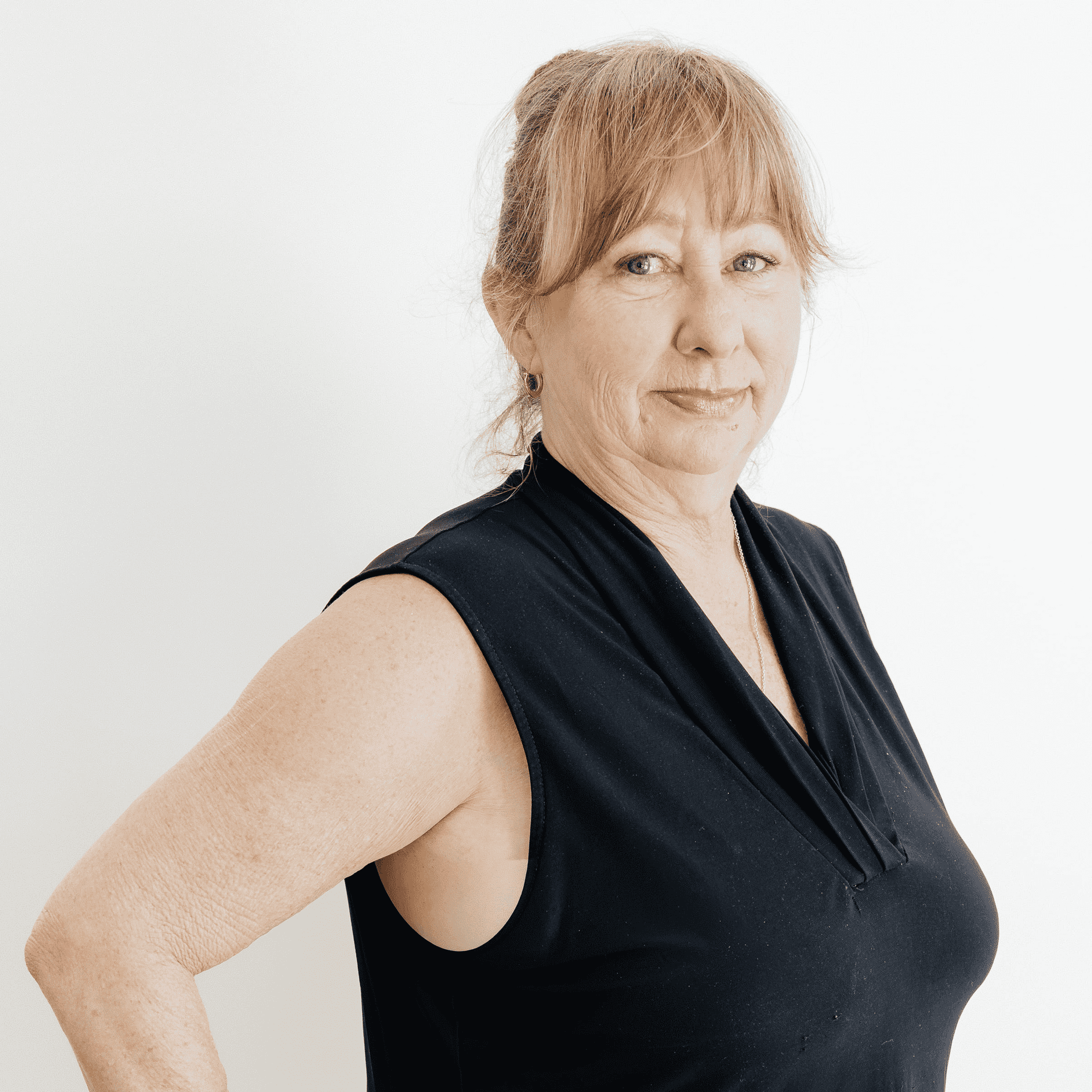 Portrait of Lisa Besix, a professional stylist at Flying Scissors Salon & Spa, showcasing their expertise and style.