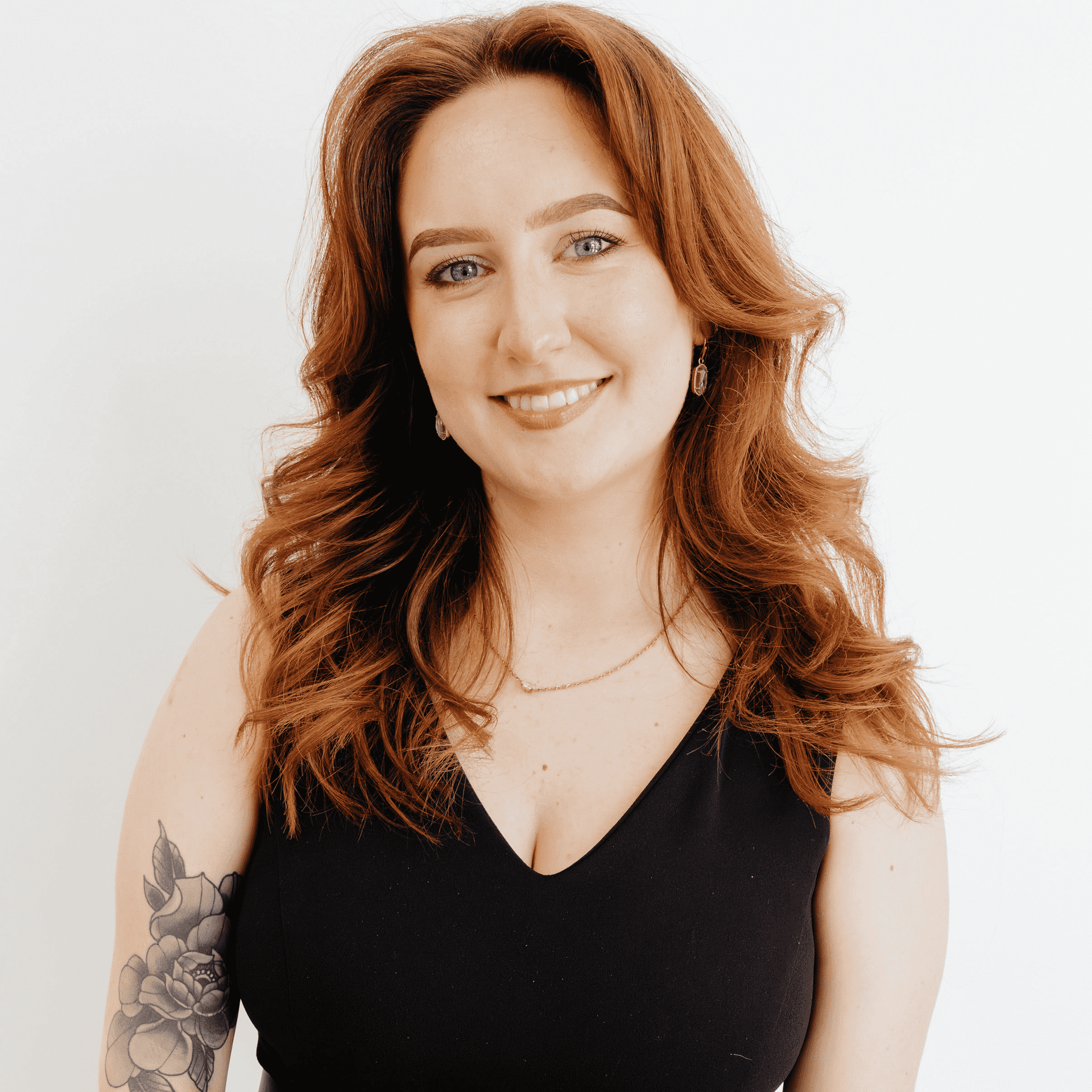 Portrait of Carrie Gilley, a professional stylist at Flying Scissors Salon & Spa, showcasing their expertise and style.