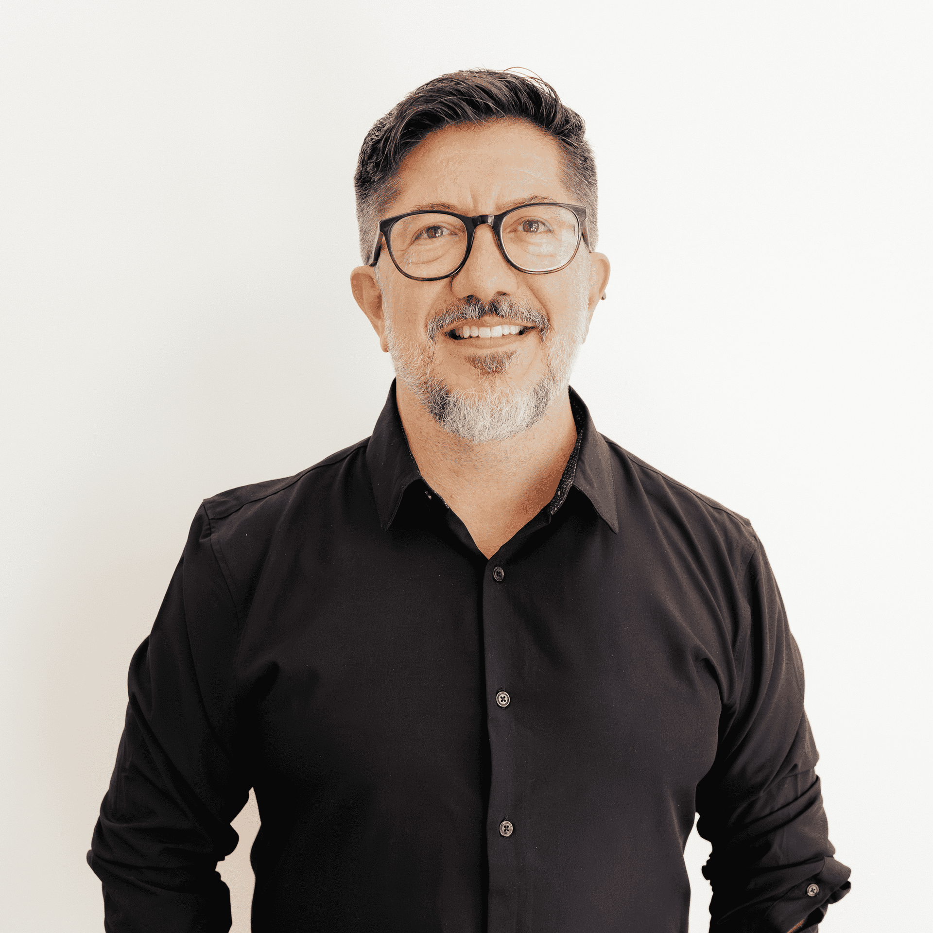 Portrait of Giovanny Andrade, a professional stylist at Flying Scissors Salon & Spa, showcasing their expertise and style.