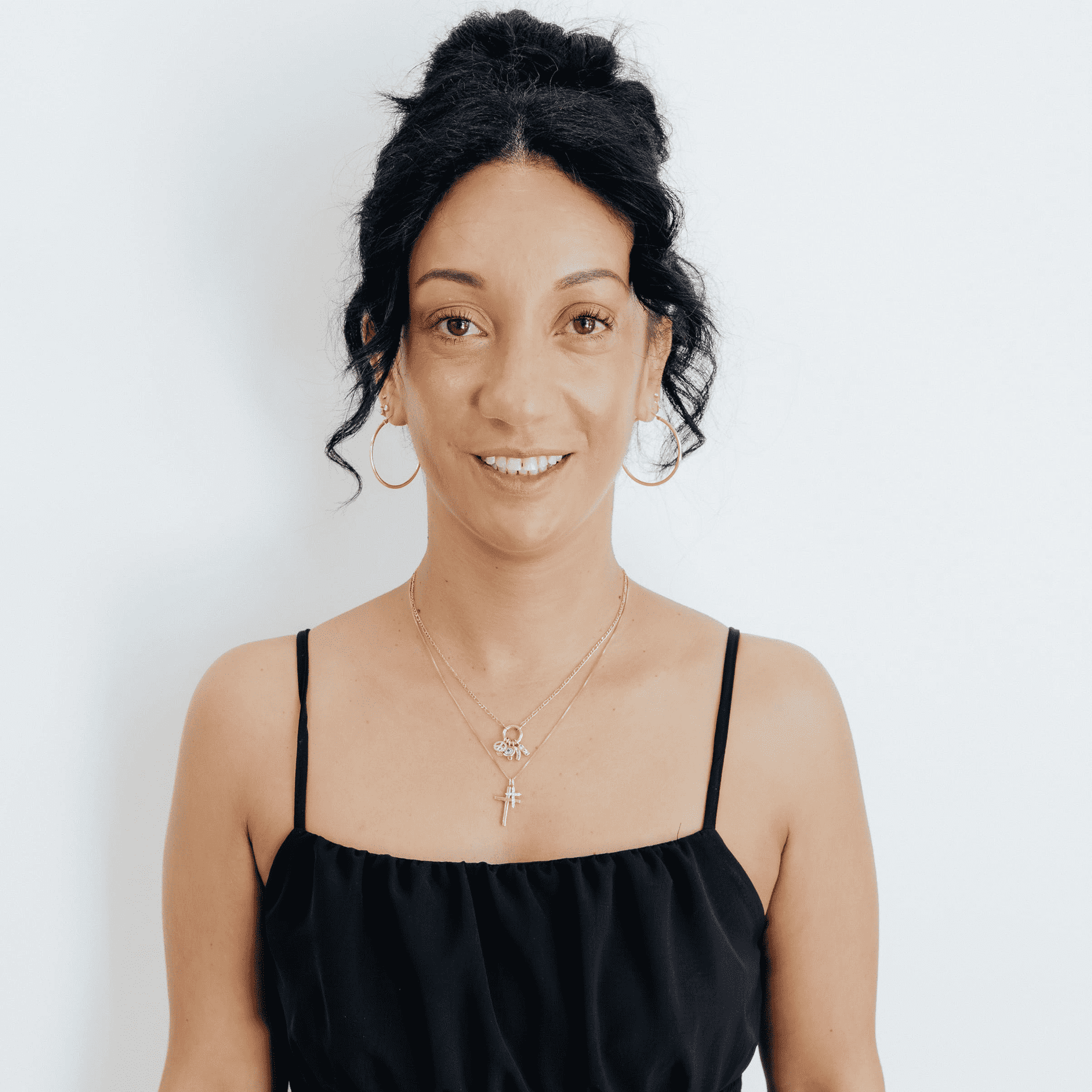 Portrait of Frenchesca Nieles, a professional stylist at Flying Scissors Salon & Spa, showcasing their expertise and style.