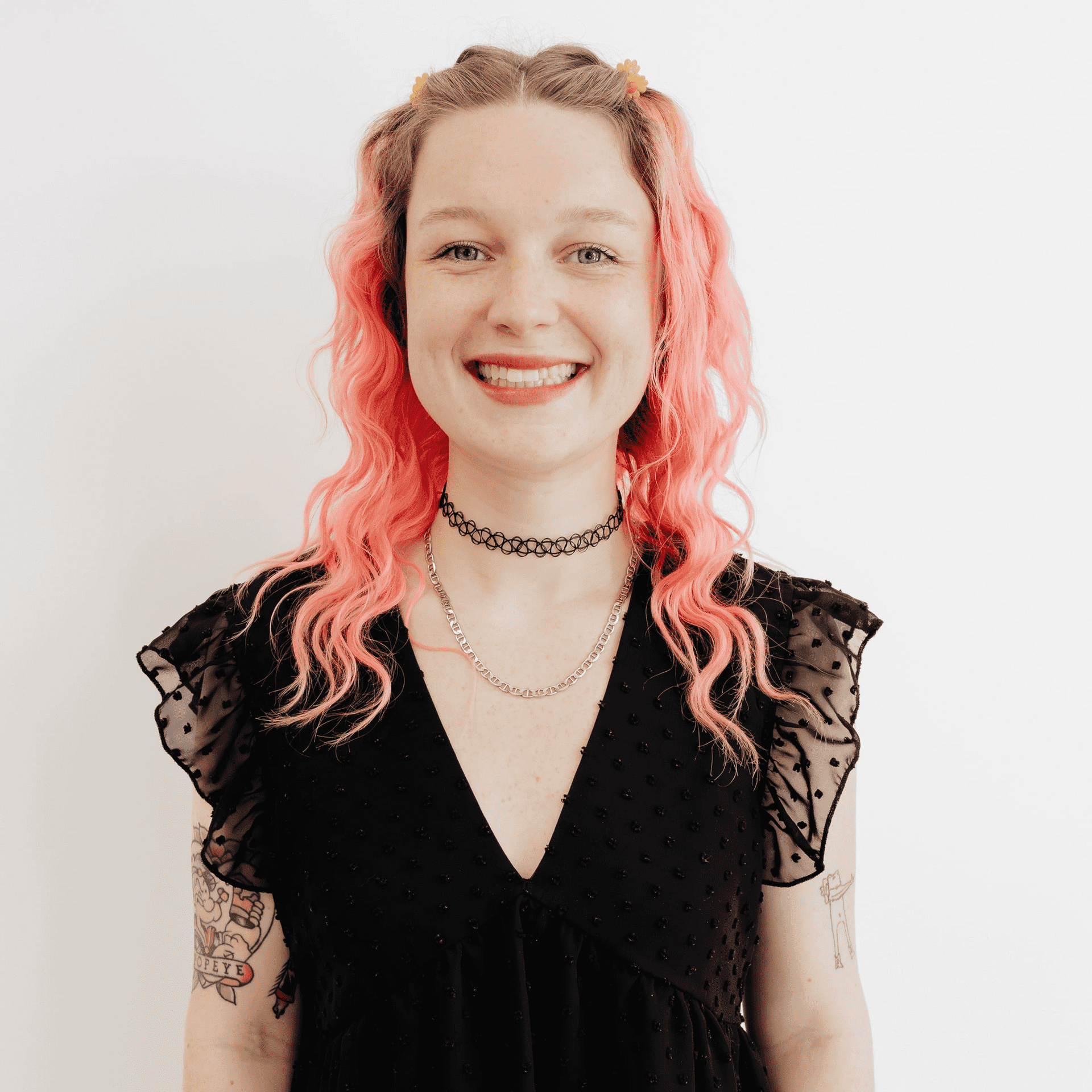 Portrait of Allie Dennis, a professional stylist at Flying Scissors Salon & Spa, showcasing their expertise and style.