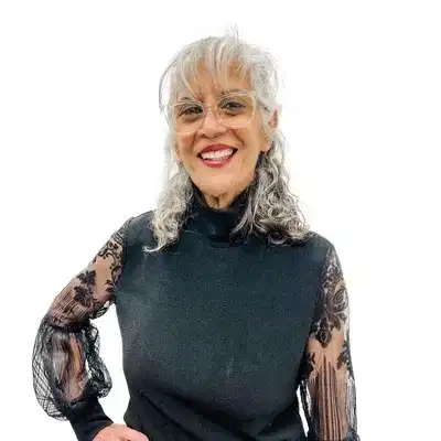 Portrait of Nooshin Almasi, a professional stylist at Flying Scissors Salon & Spa, showcasing their expertise and style.